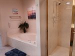 Master bathroom with tub and walk in shower